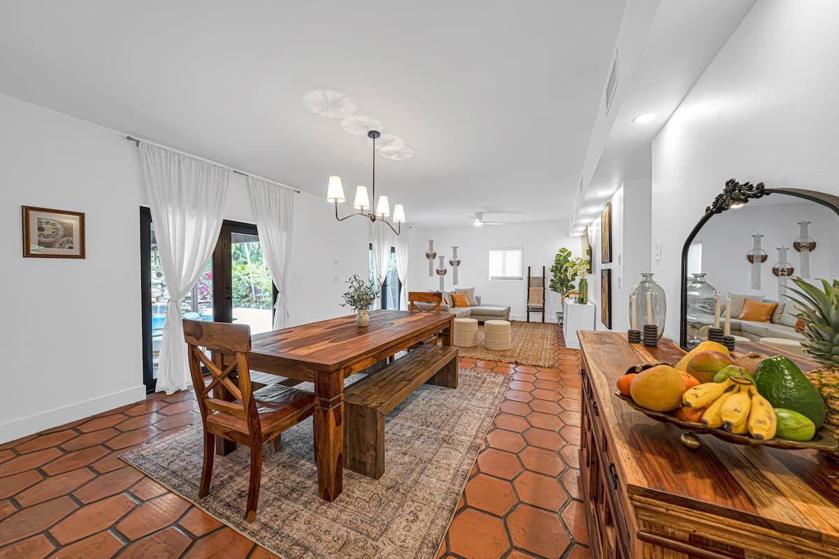 Image may contain Floor Home Decor Architecture Building Dining Room Dining Table Furniture Indoors Room and Table