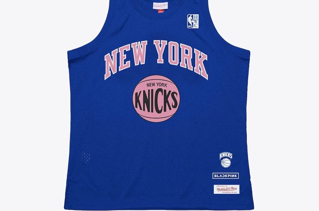 Blue sleeveless Knicks basketball jersey with pink basketball logo and 'NEW YORK' text across the chest.