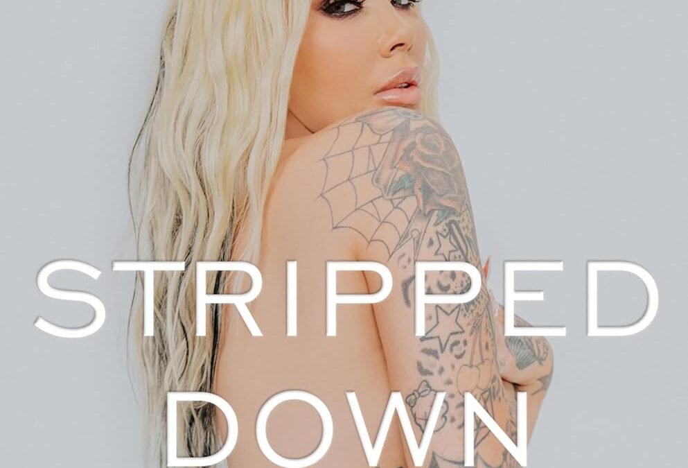 Book cover: tattooed topless woman with long blonde hair; pink 'Bunnie XO' at the top, white 'STRIPPED DOWN' across the center, with subtitle 'Unfiltered and Unapologetic'.
