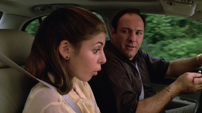 Jamie-Lynn Sigler as Meadow sitting in the car next to James Gandolfini as Tony in The Sopranos