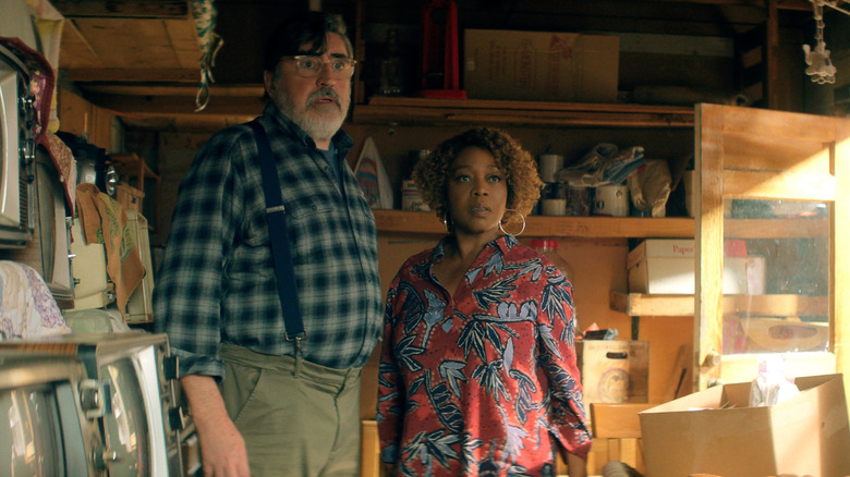 Sam (Alfred Molina) and Judy (Alfre Woodard) standing together in The Boroughs