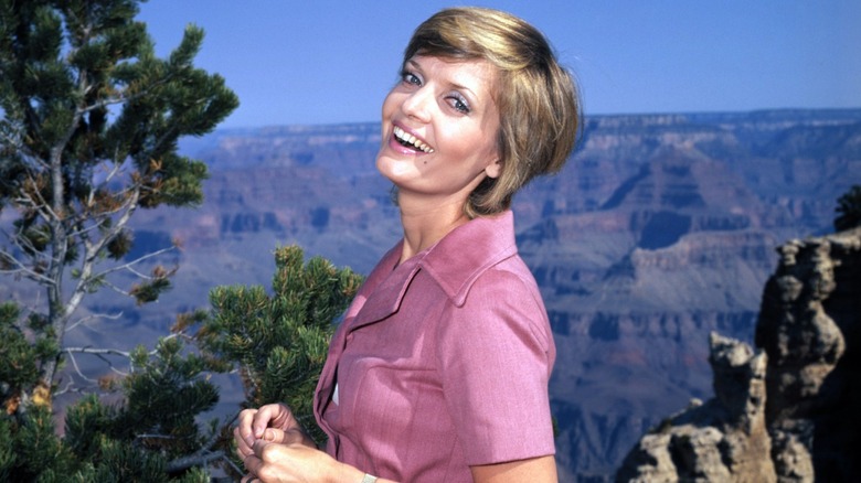 Florence Henderson in a pink blouse smiling