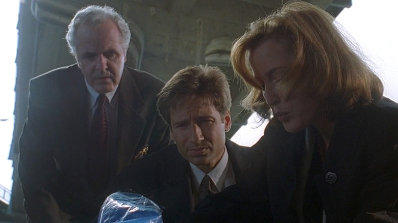 James Handy as Detective Cross with David Duchovny as Fox Mulder and Gillian Anderson as Dana Scully in "The X-Files."