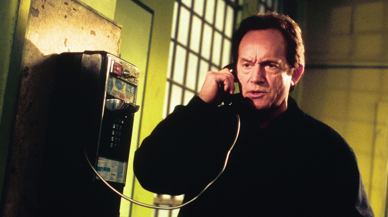 Lance Henriksen as Frank Black talking on the phone in Millennium