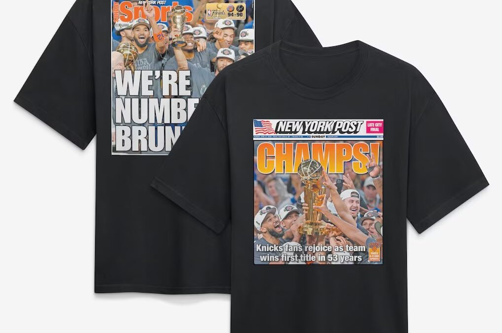 Black T-shirts featuring New York Post sports magazine cover designs; front shirt says CHAMPS! with a team holding a trophy, back shirt shows 'WE'RE NUMBER BRU...' celebration image.