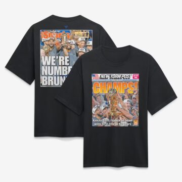 Black T-shirts featuring New York Post sports magazine cover designs; front shirt says CHAMPS! with a team holding a trophy, back shirt shows 'WE'RE NUMBER BRU...' celebration image.