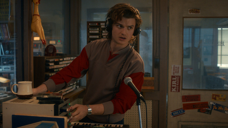 Steve (Joe Keery) working behind a microphone in Stranger Things