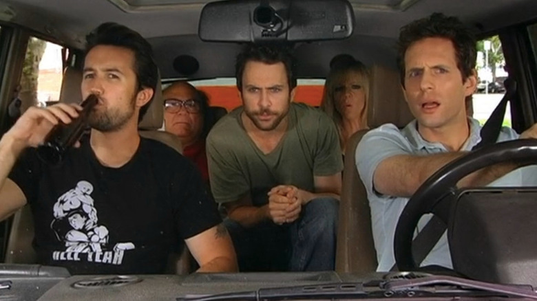 Rob Mac as Mac, Danny DeVito as Frank, Charlie Day as Charlie, Kaitlin Olson as Dee, and Glenn Howerton as Dennis driving in car in It's Always Sunny in Philadelphia