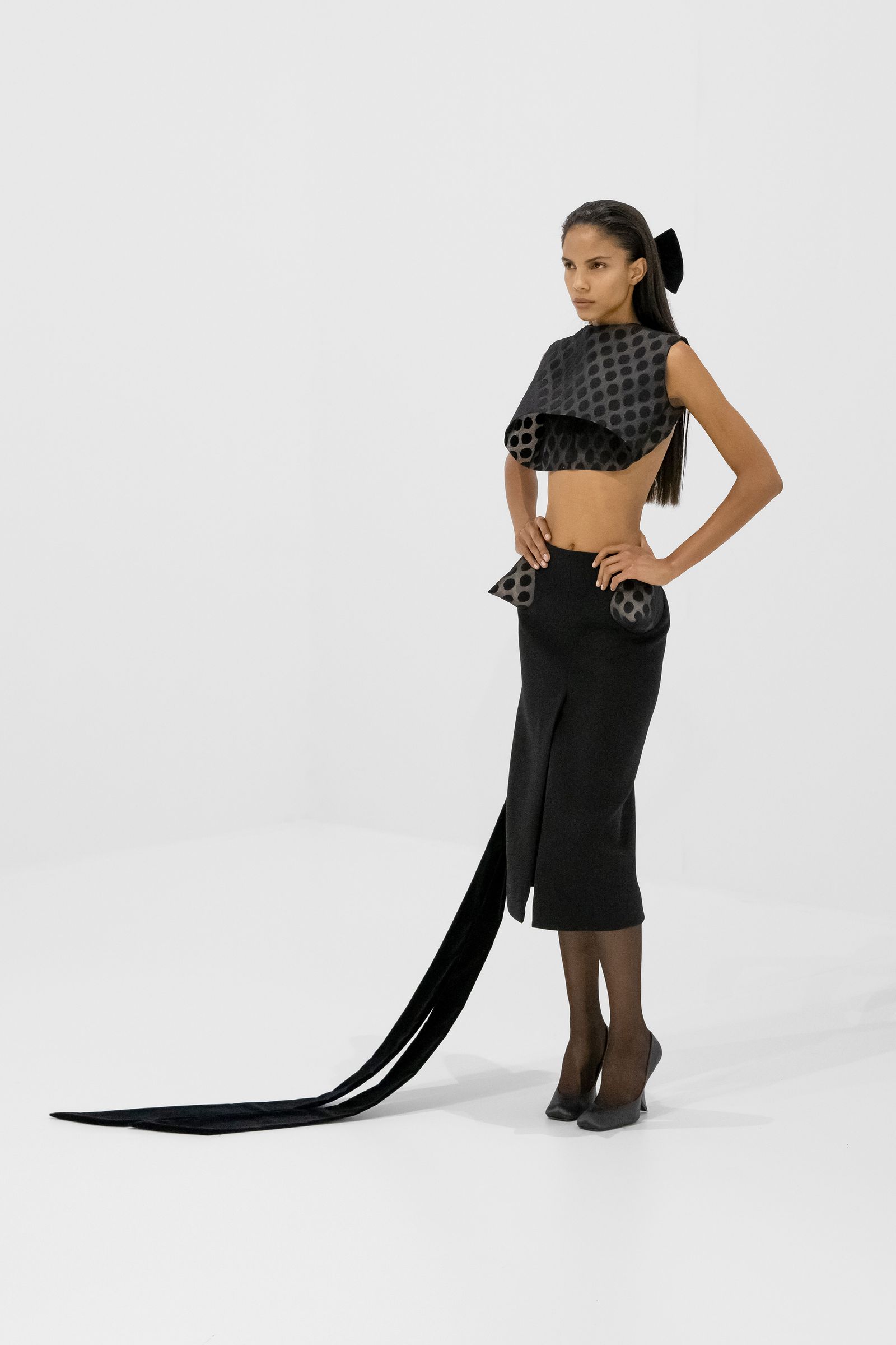 Image may contain Blouse Clothing Adult Person Skirt Footwear High Heel Shoe Dress Formal Wear and Pants