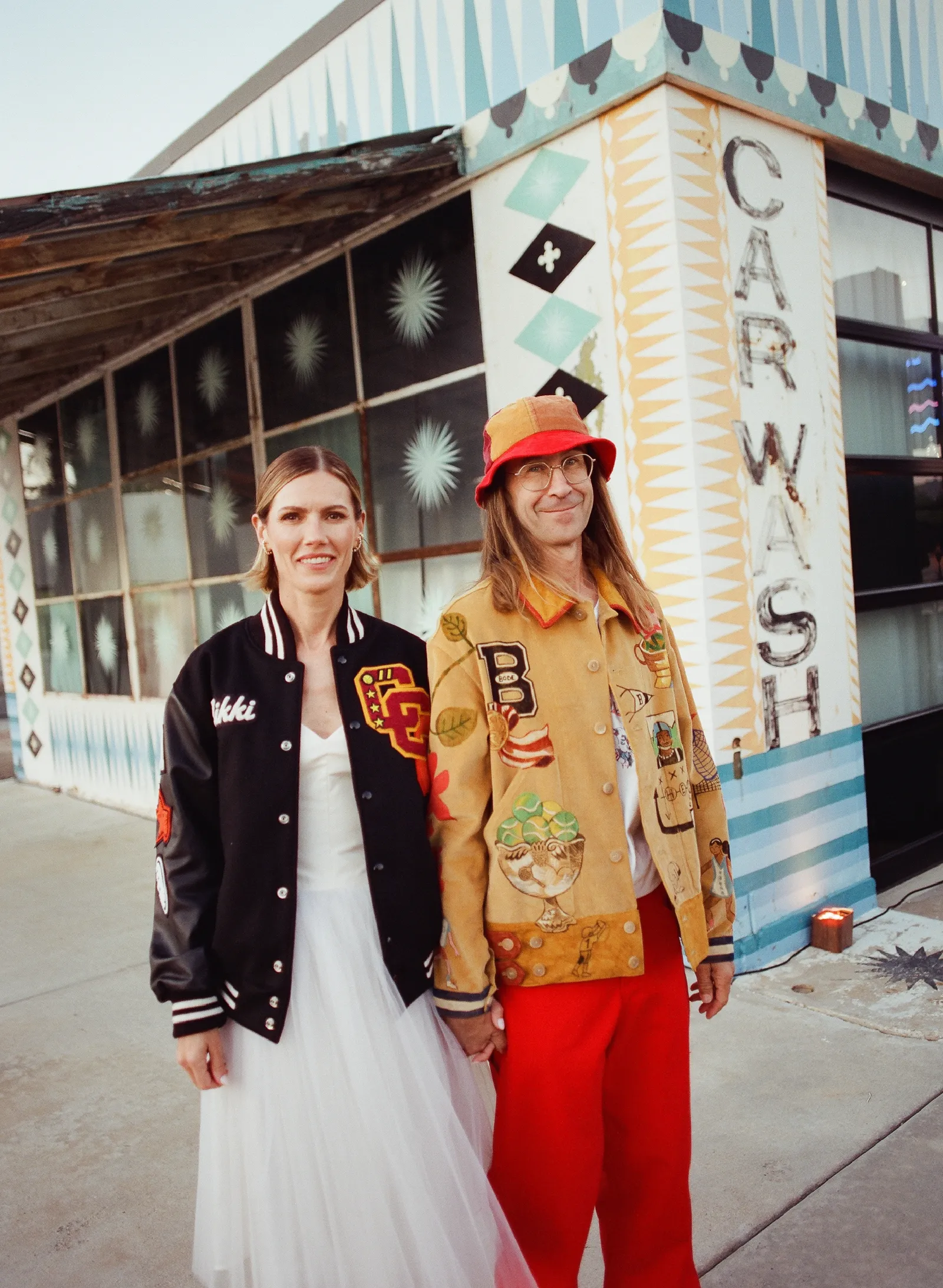 Image may contain Clothing Coat Jacket Blazer Face Head Person Photography Portrait Pants and Architecture