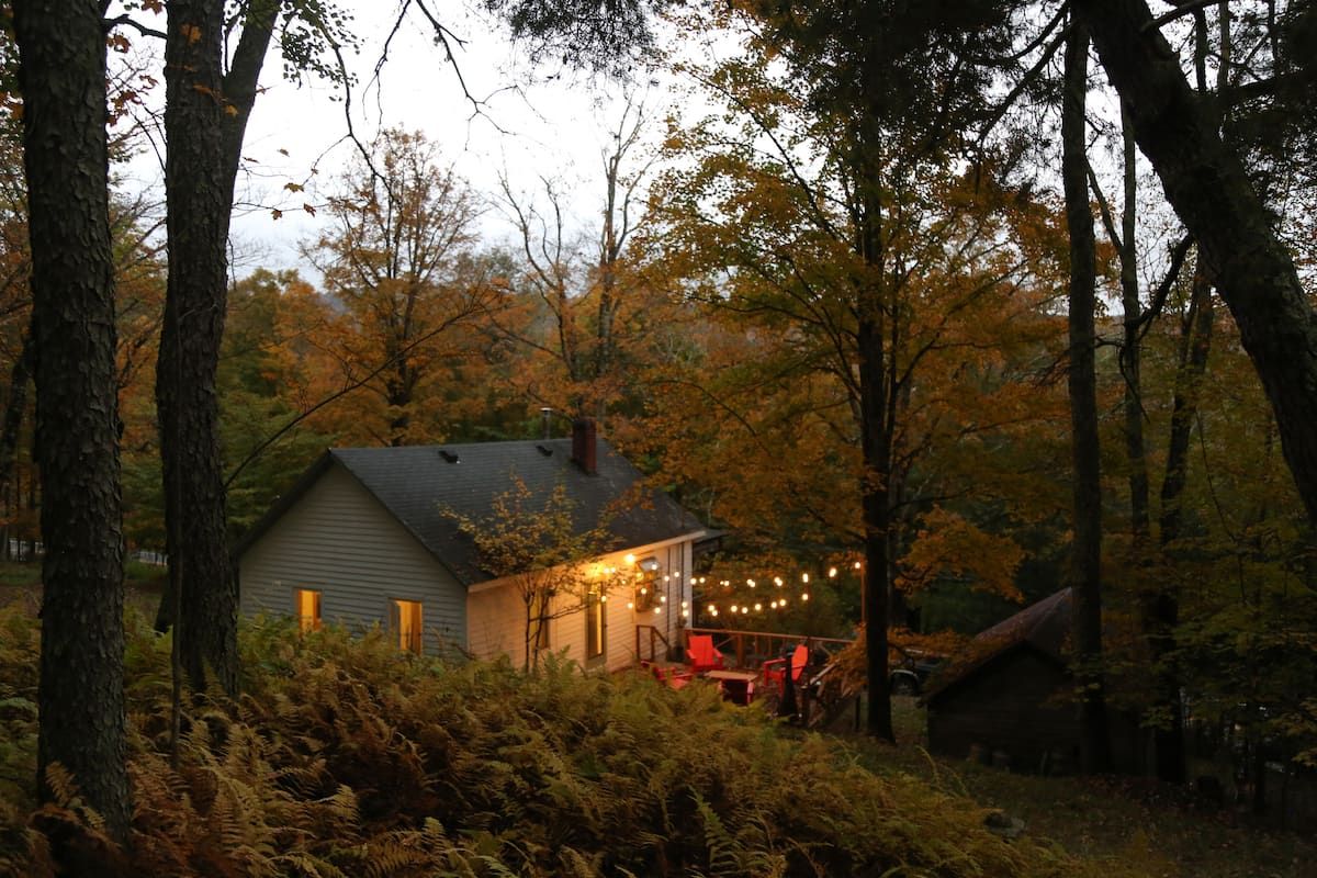 Image may contain Architecture Building Housing House Cabin Cabin In The Woods Person and Cottage