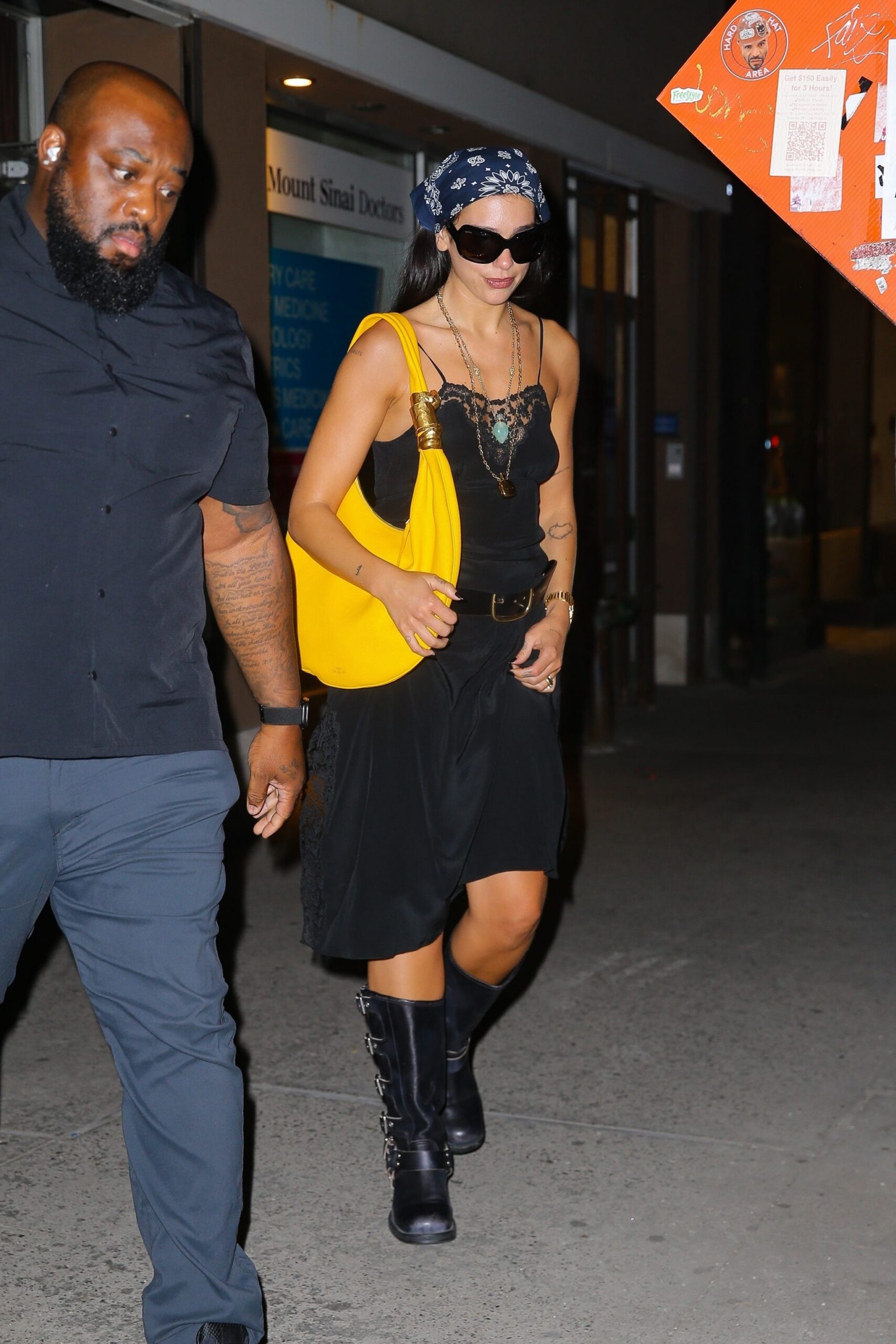 exclusive new york, ny dua lipa was spotted leaving electric lady studios in new york, showcasing another standout off duty look the singer paired a black lacetrim camisole with a flowing black skirt and chunky buckle boots, accessorizing with oversized sunglasses, a printed headscarf, layered necklaces, and a bold yellow shoulder bag as she departed the iconic recording studio pictured dua lipa backgrid usa 14 july 2026 usa 1 310 798 9111  usasalesbackgridcom uk 44 208 344 2007  uksalesbackgridcom uk clients  pictures containing children please pixelate face prior to publication