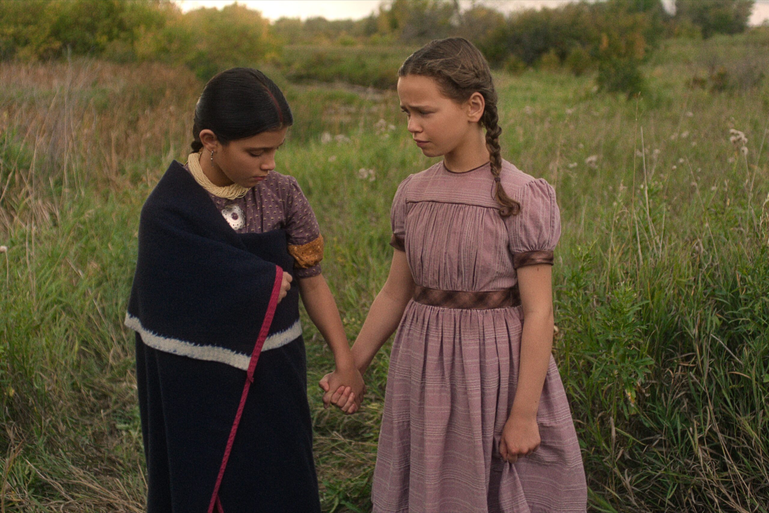 L-R: Wren Zhawenim Gotts as Good Eagle, Alice Halsey as Laura Ingalls in Netflix's 'Little House on the Prairie'