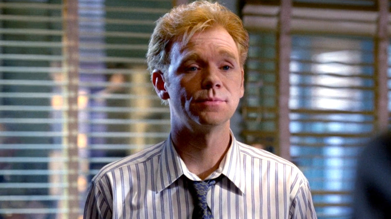 David Caruso wearing a white striped shirt and a blue tie on "NYPD Blue"