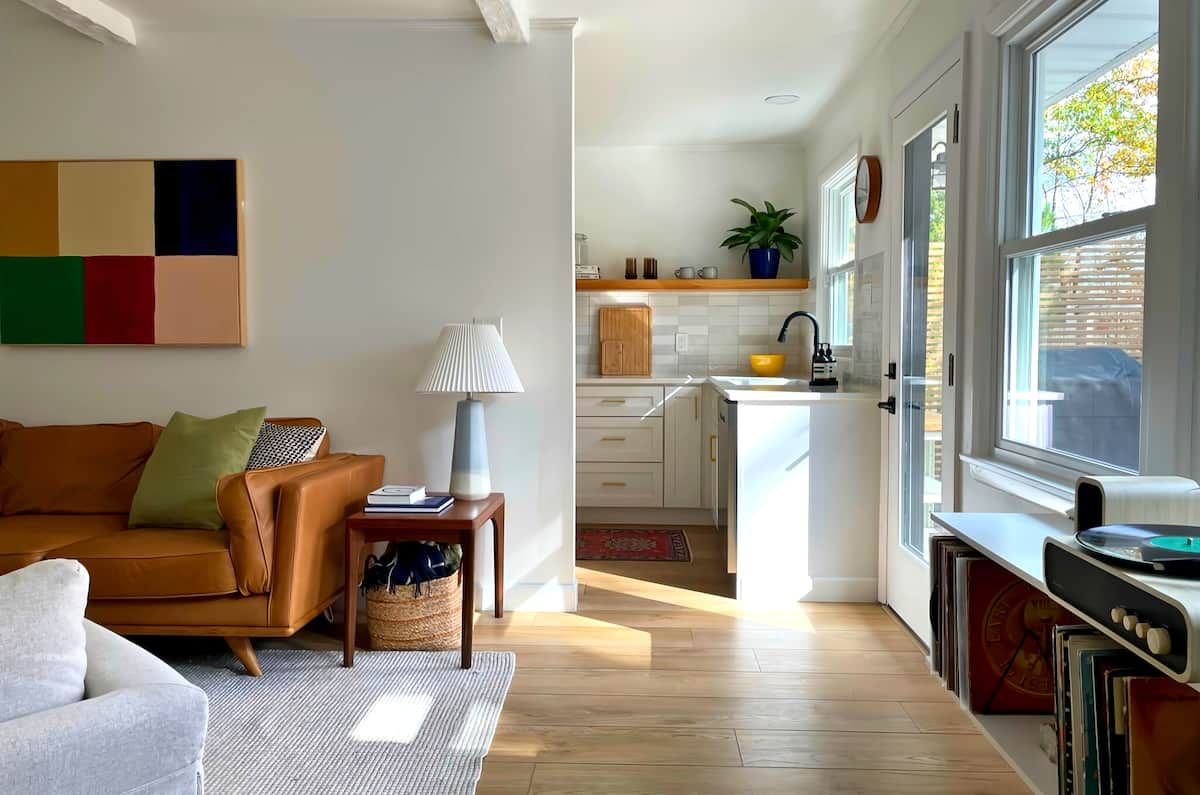 Image may contain Lamp Plant Indoors Interior Design Book Publication Couch Furniture Home Decor Rug and Desk