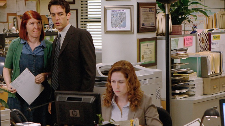 Ryan and Meredith watch Pam with suspicion in The Office.