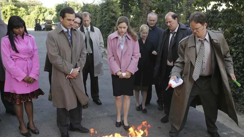 The office gathers around a burning box in The Office.