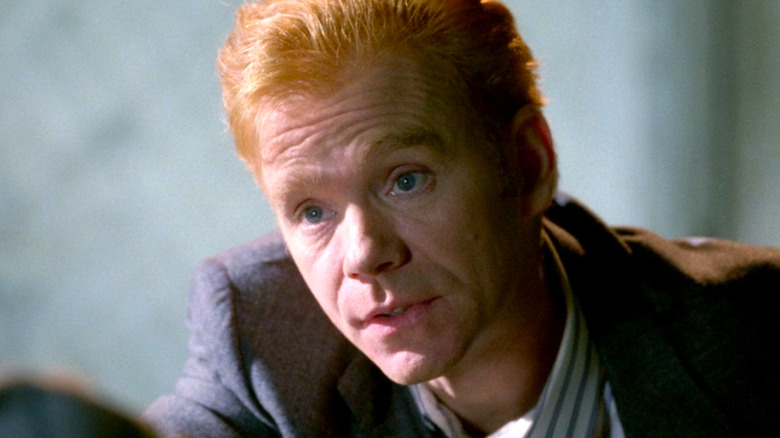 David Caruso with ginger hair wearing a brown suit and a white shirt on "NYPD Blue"