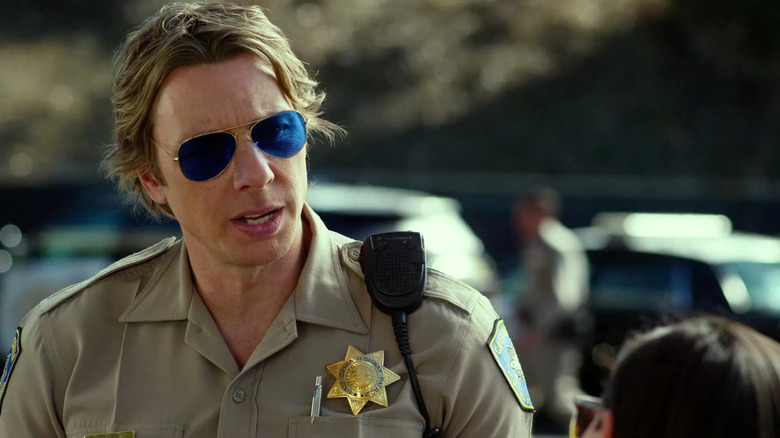 Jon Baker in a patrolman's uniform and sunglasses in CHiPs (2017)