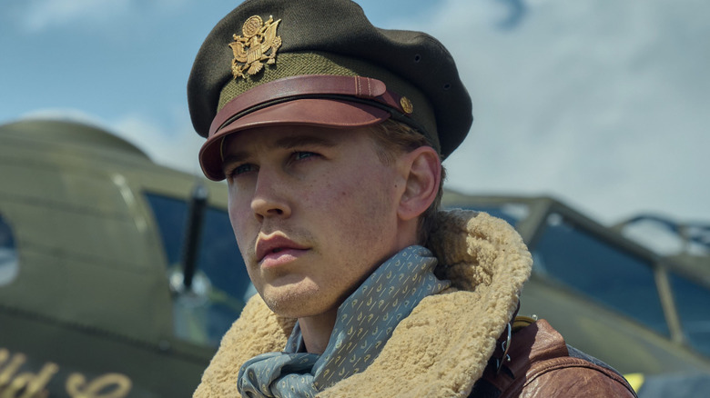 Austin Butler as Major Gale "Buck" Cleven, standing next to a plane in Masters of the Air.