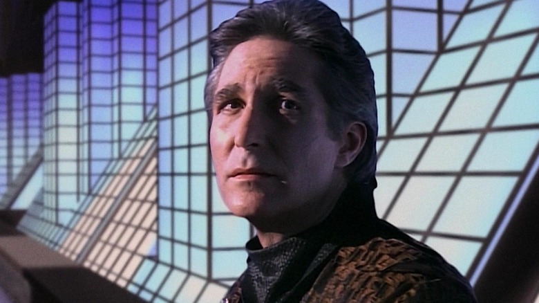 Commander Jeffrey Sinclair standing in front of glowing blue blocks in Babylon 5