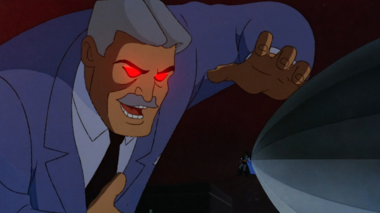 A hallucination of a large older Thomas Wayne with gray hair, a mustache, and glowing red eyes. He's wearing a blue suit and is looming over a blimp with a small superhero in a gray and black outfit hanging on to the front of it.