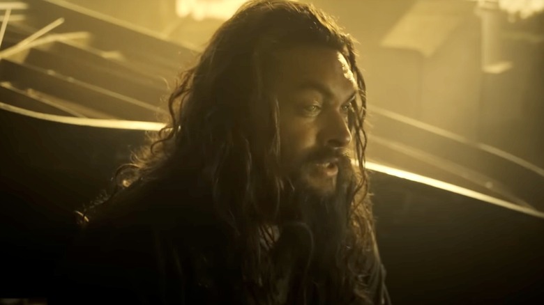 Baba Voss (Jason Momoa) standing in a dark room on "See."