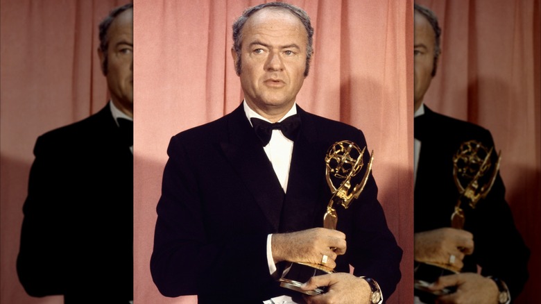 Harvey Korman holding an Emmy