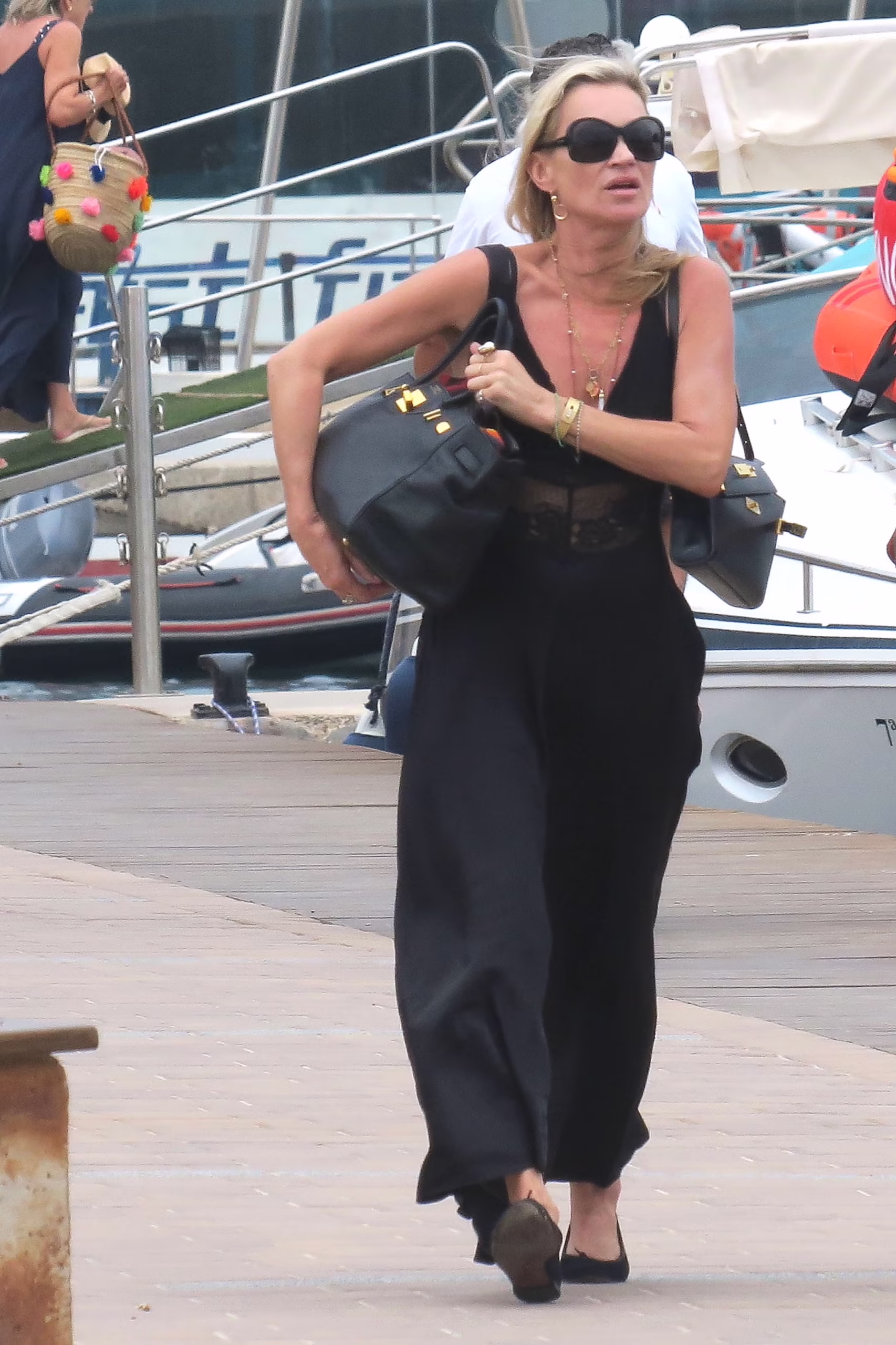 exclusive formentera, spain web must call for pricing kate moss is photographed walking through the port in formentera during her summer getaway with her good friend rosemary ferguson the supermodel wore a flowing black maxi dress with a plunging neckline, black sunglasses and looking a little exasperated as she carried her designer black hermes birkin bag as she made her way along the waterfront shot on 08032026 pictured kate moss backgrid usa 5 august 2026 byline must read cobra team  backgrid usa 1 310 798 9111  usasalesbackgridcom uk 44 208 344 2007  uksalesbackgridcom uk clients pictures containing children please pixelate face prior to publication