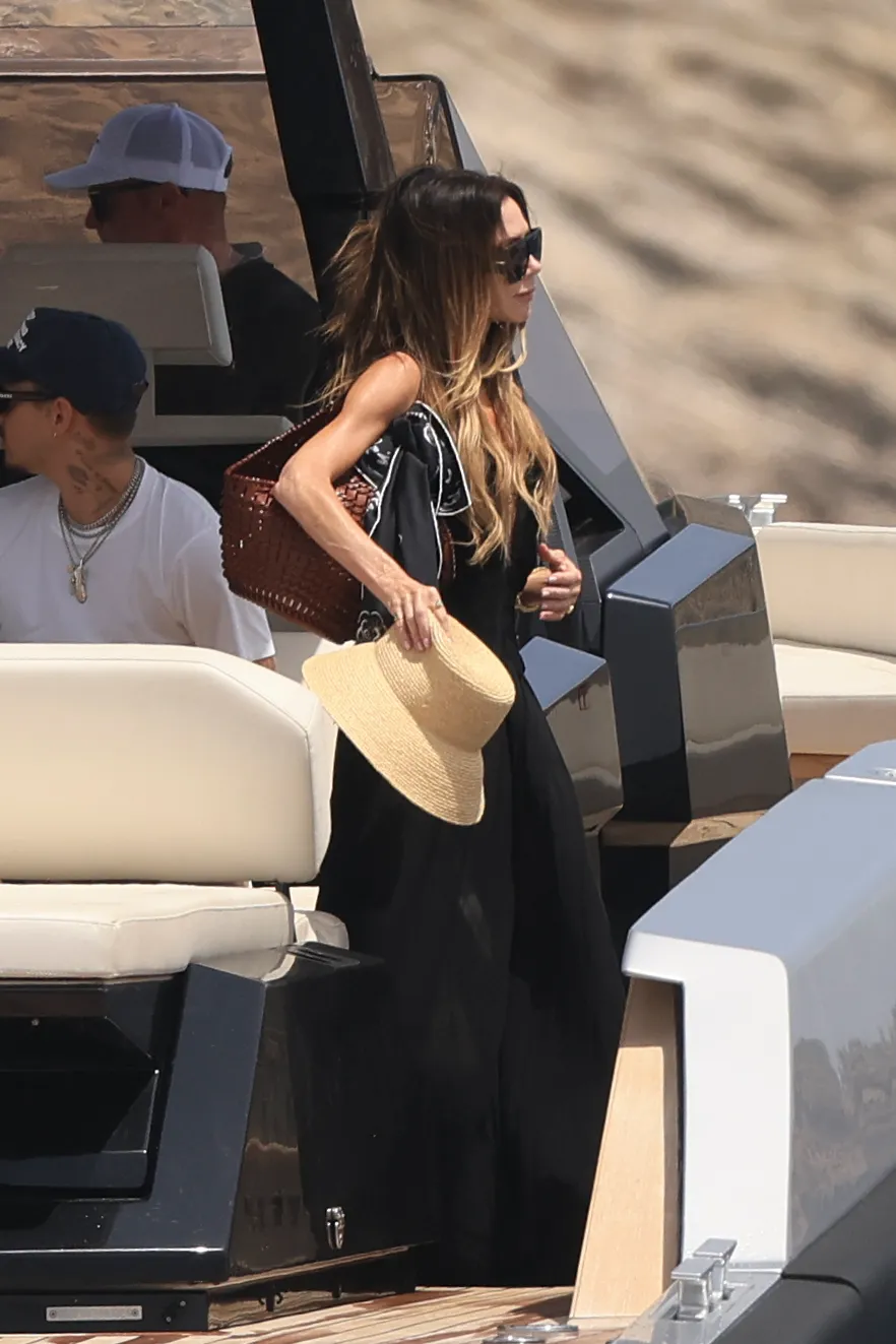 Image may contain Victoria Beckham Beachwear Clothing Adult Person Accessories Bag Handbag Jewelry and Necklace