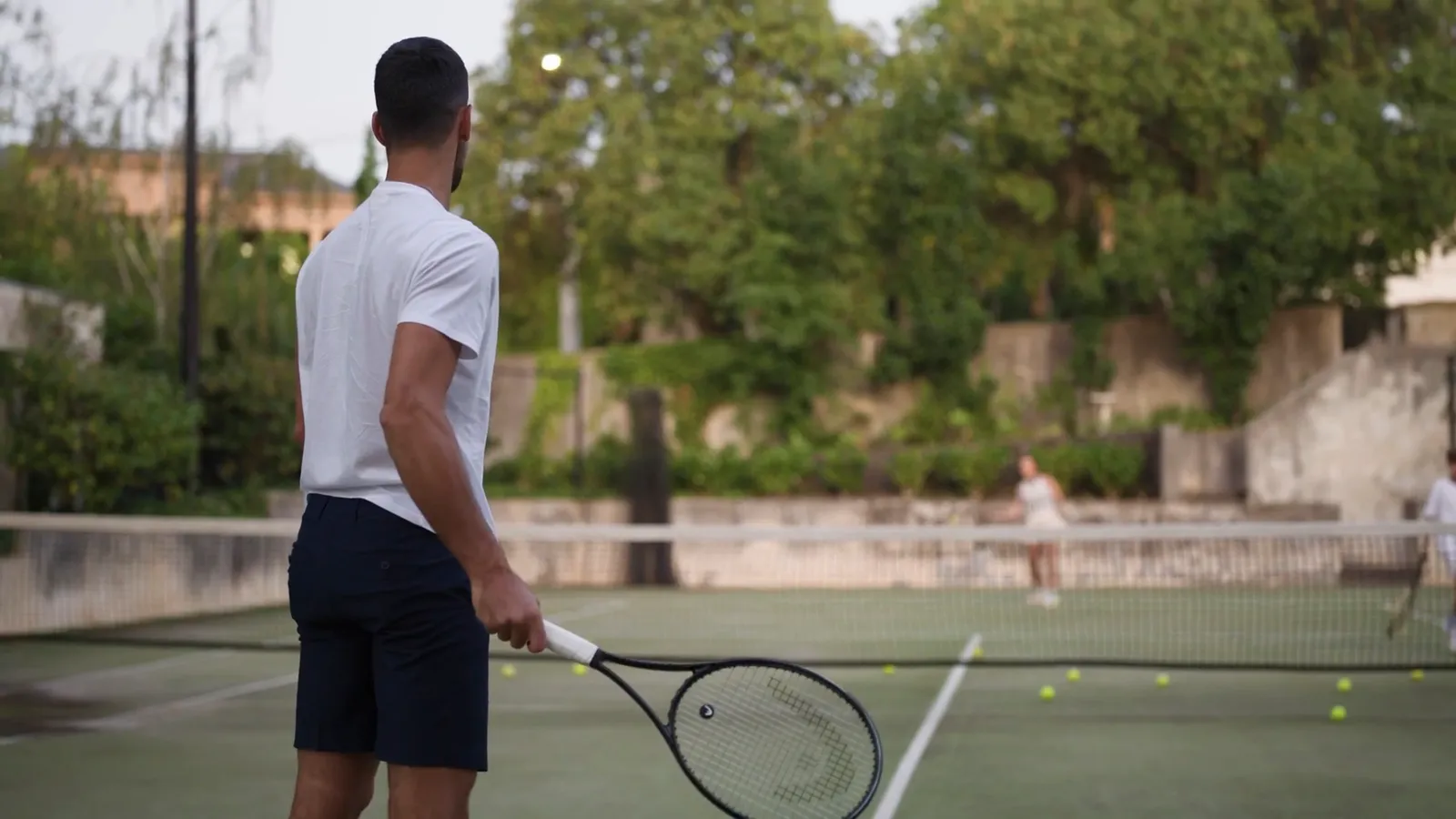 Image may contain Racket Sport Tennis Tennis Racket Ball Tennis Ball Person and Adult