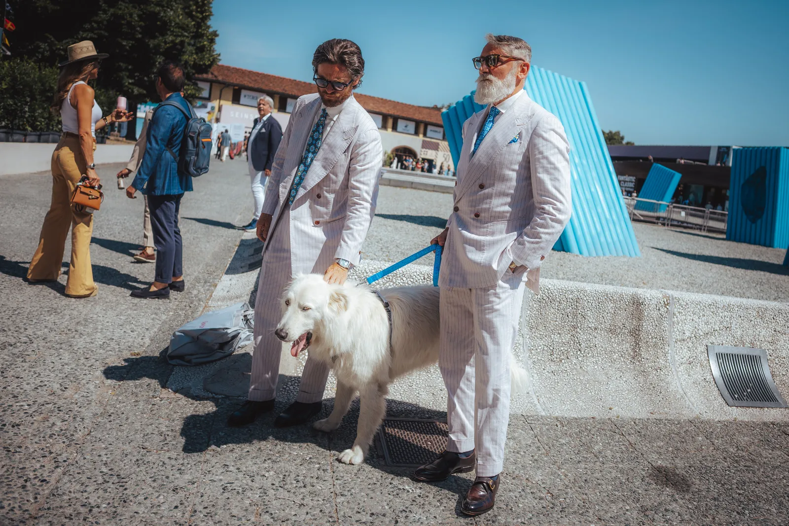 Image may contain Pierre Restany Emilio de Villota Adult Person Animal Canine Dog Mammal Pet Clothing and Coat