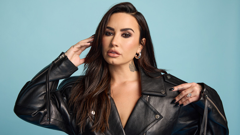 Demi Lovato poses for a portrait in a black leather jacket at the 2024 Rock & Roll Hall Of Fame Induction Ceremony streaming on Disney+ at Rocket Mortgage Fieldhouse on October 19, 2024.