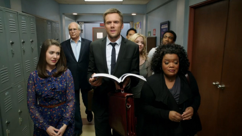 Jeff leads the Study Group down a corridor at Greendale in "Community" (2009)