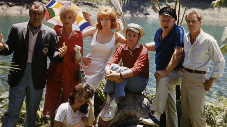 the full cast of "Gilligan's Island" (1964) pose for a promotional photograph