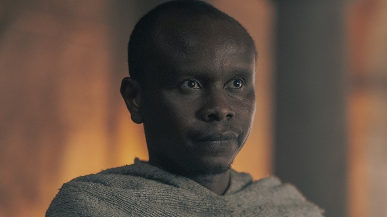 Grand Maester Orwyle looking on while wearing gray robes