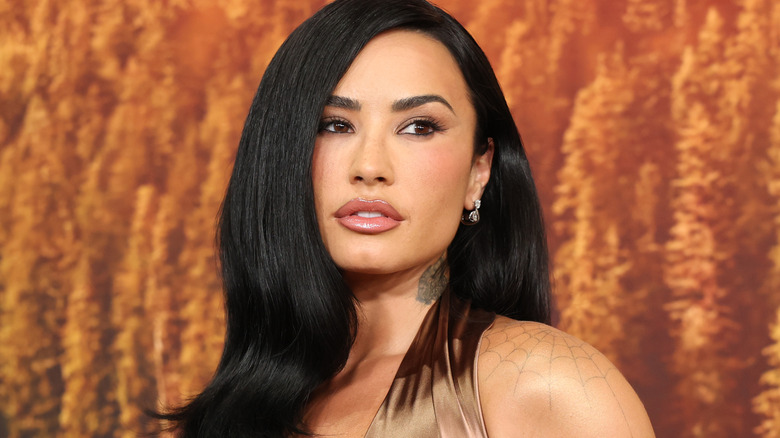 Demi Lovato in a copper-colored dress at the Los Angeles premiere of Disney's "Camp Rock 3" at Walt Disney Studios on August 10, 2026.