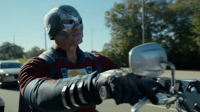 John Cena as Peacemaker rides a custom cycle through another dimension of hidden dangers.