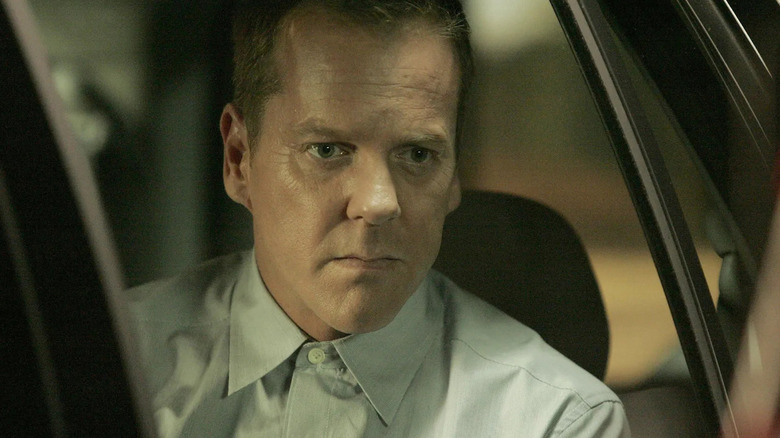 Jack Bauer sitting contemplatively in a car