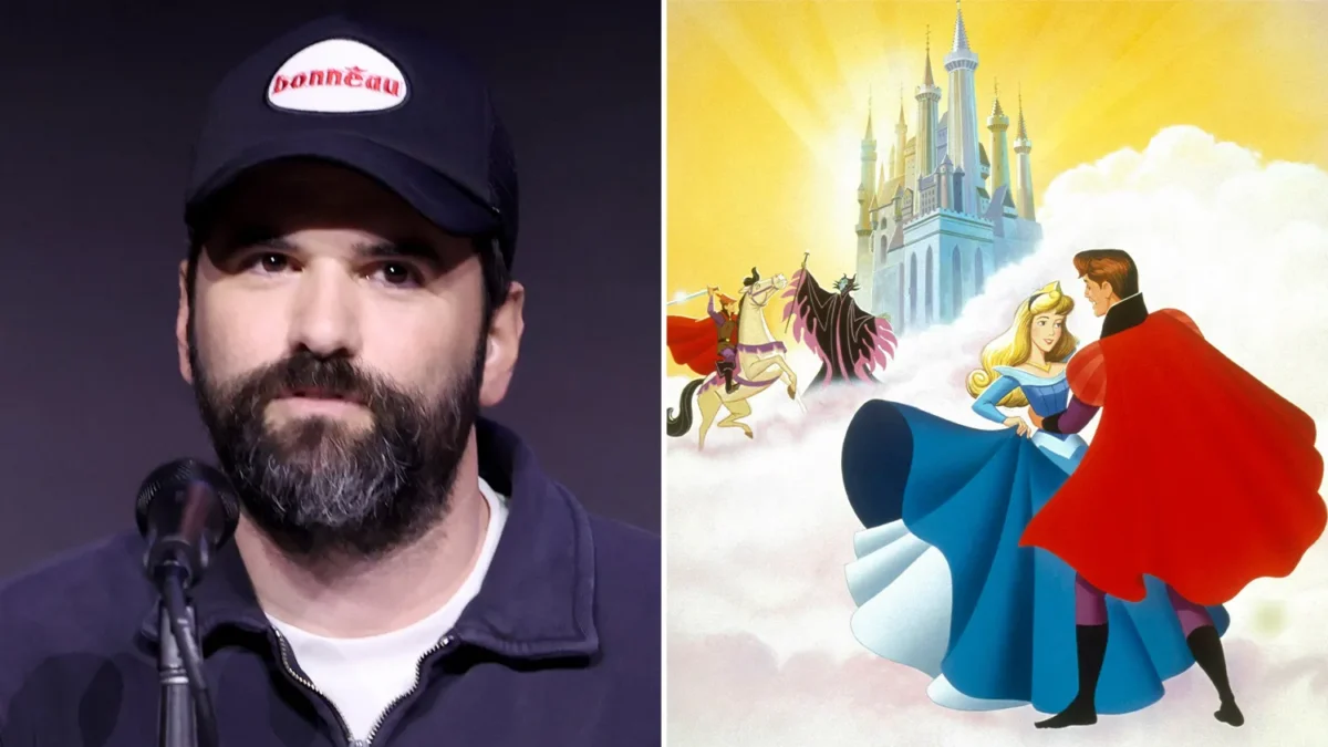 A bearded man in a cap sits at a microphone beside an animated scene of a castle and dancing couple.