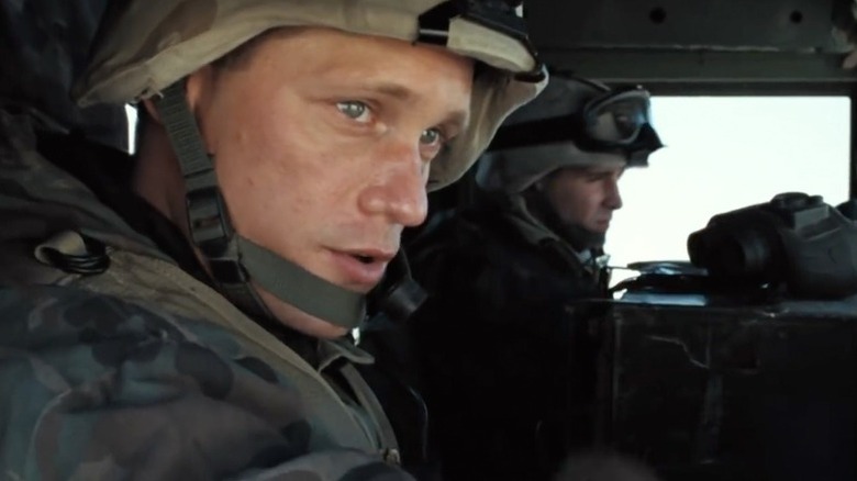 Brad Colbert riding in a Humvee and looking out the window