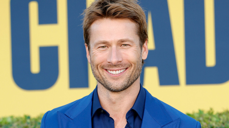 Glen Powell in a blue suit and matching shirt at the Red Carpet Premiere of Hulu's "Chad Powers" at Rose Bowl Stadium on September 25, 2025 in Pasadena, California.