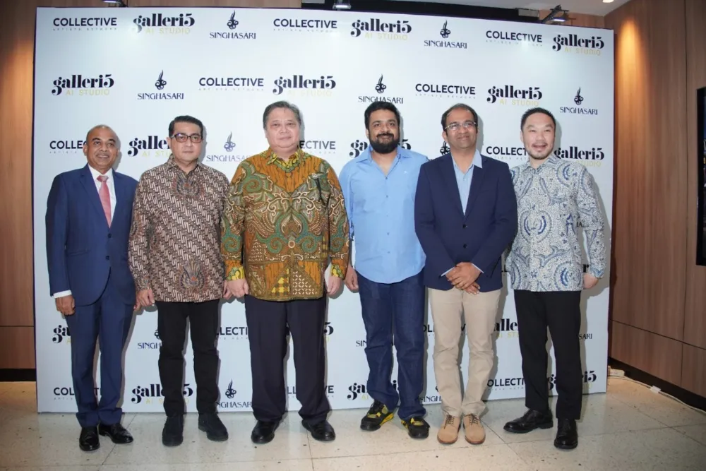Six men stand side by side in suits and patterned shirts before a branded step-and-repeat backdrop.
