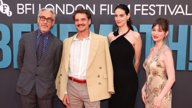 Four people in formal attire pose in front of a BFI London Film Festival backdrop.