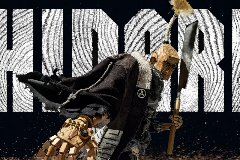 A wooden puppet warrior holding an axe stands before large white textured lettering on a dark background.