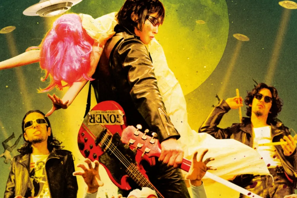 Three men in leather jackets pose with guitars as a pink-haired figure is slung over one shoulder beneath UFOs.