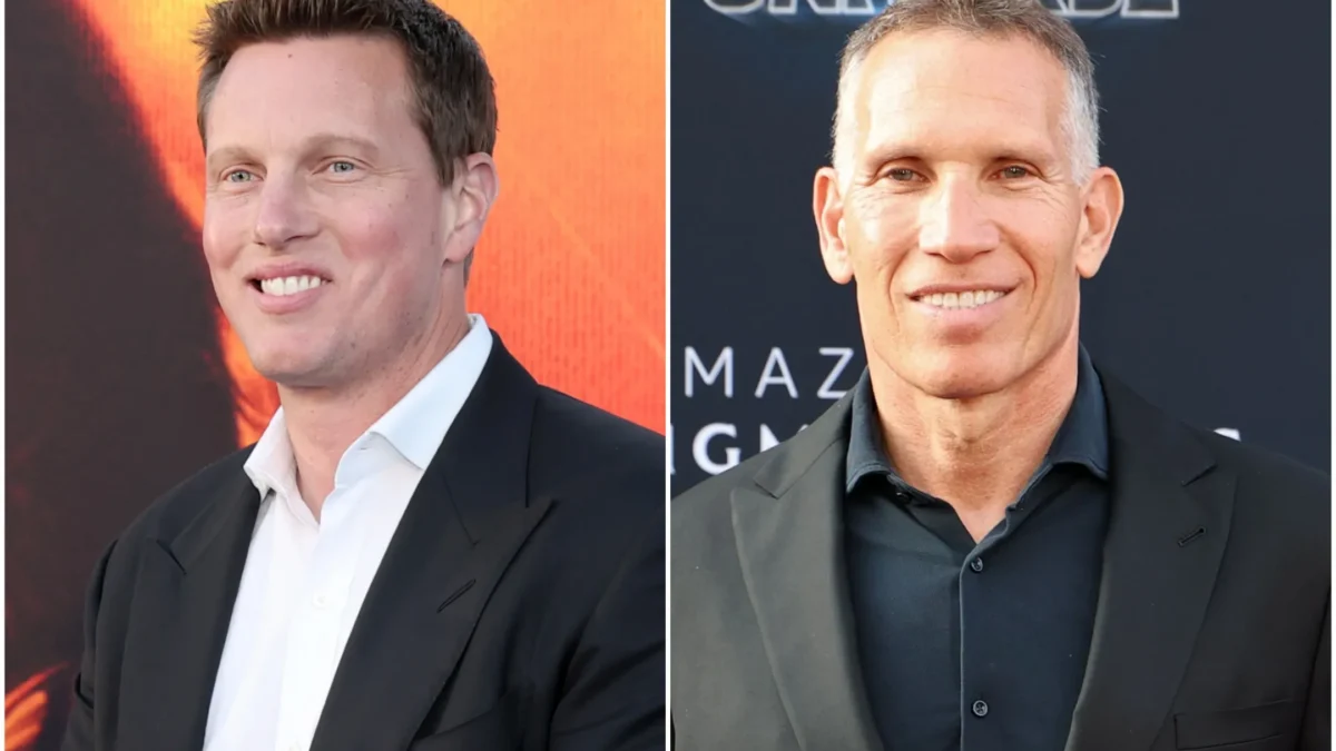 Two smiling men in dark suits appear side by side against separate promotional backdrops.