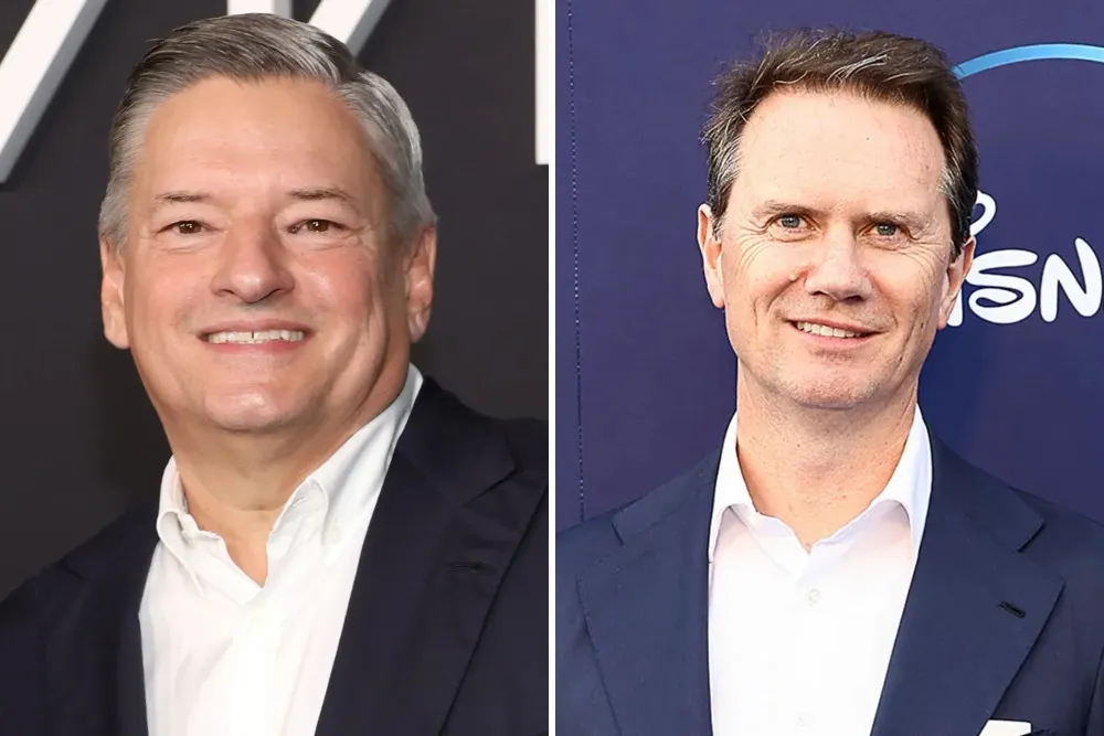 Two smiling men in dark suits and white shirts appear side by side against branded backdrops.